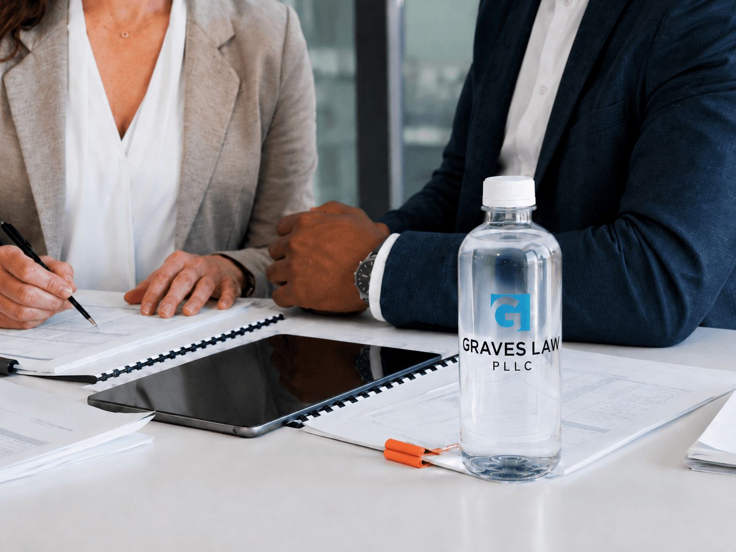 Graves Law PLLC bottle at a client consultation